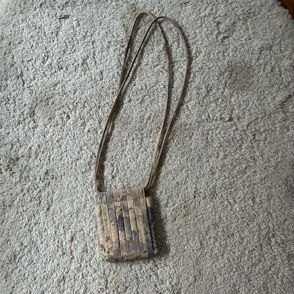 Beklina pleated leather floral print bag